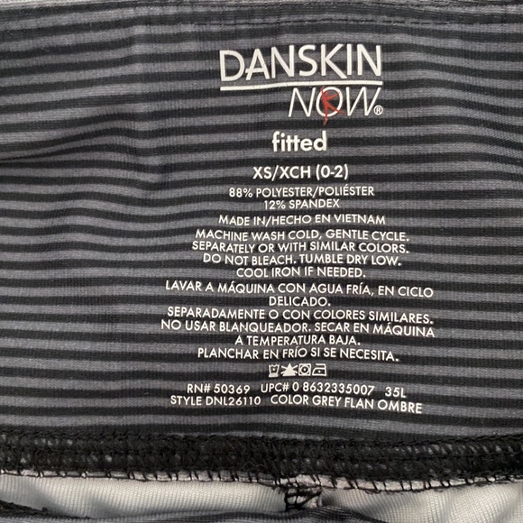 Dansko black and grey striped leggings. Cute detail of tear drop cutouts on legs - Picture 5 of 6